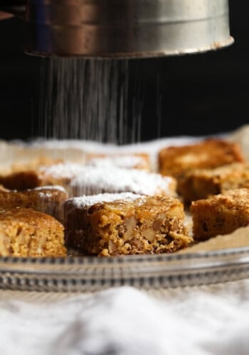 Classic Chewy Noels are a brown sugar cookie bars topped with powdered sugar