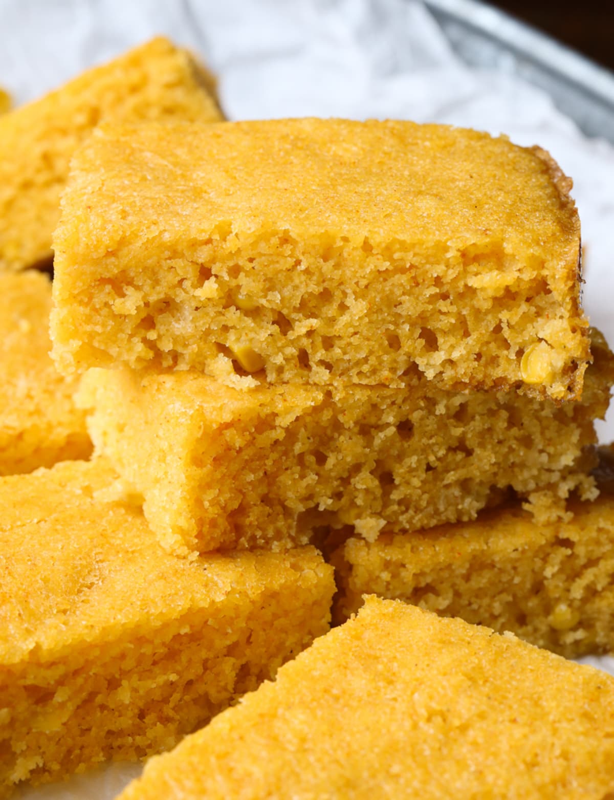 Cornbread stacked on a serving plate