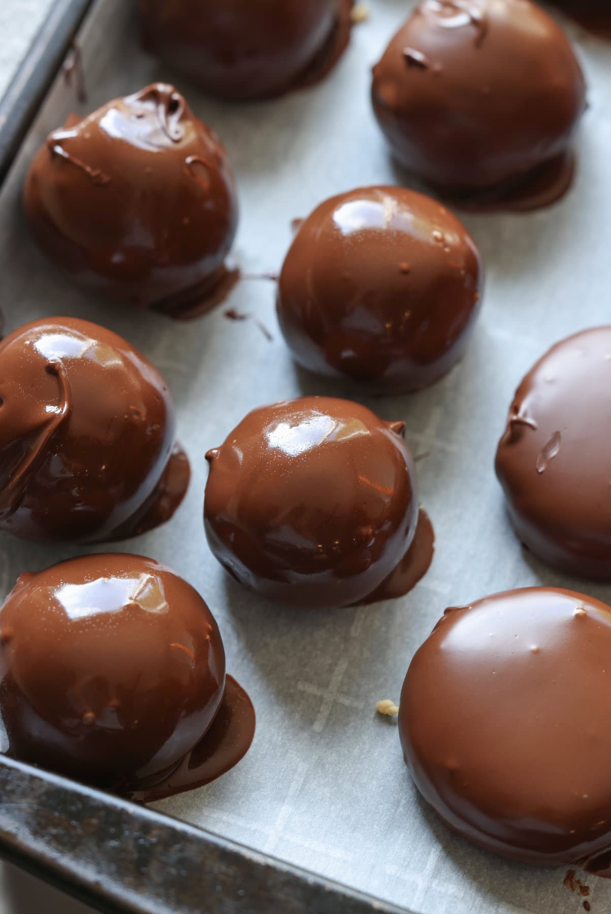 peanut butter balls still glossy after being dipped melted chocolate