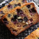 Blueberry banana bread served to eat on a cooling rack