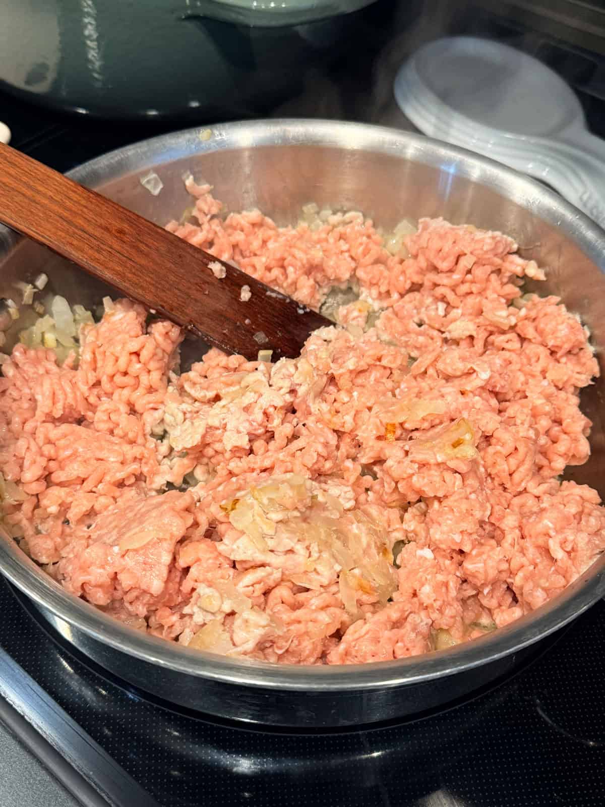 This easy beef pasta recipe is a one-pan dinner made in 30 minutes! Packed with juicy ground beef, cheese, and pasta in creamy tomato sauce. Ground beef added to a skillet.