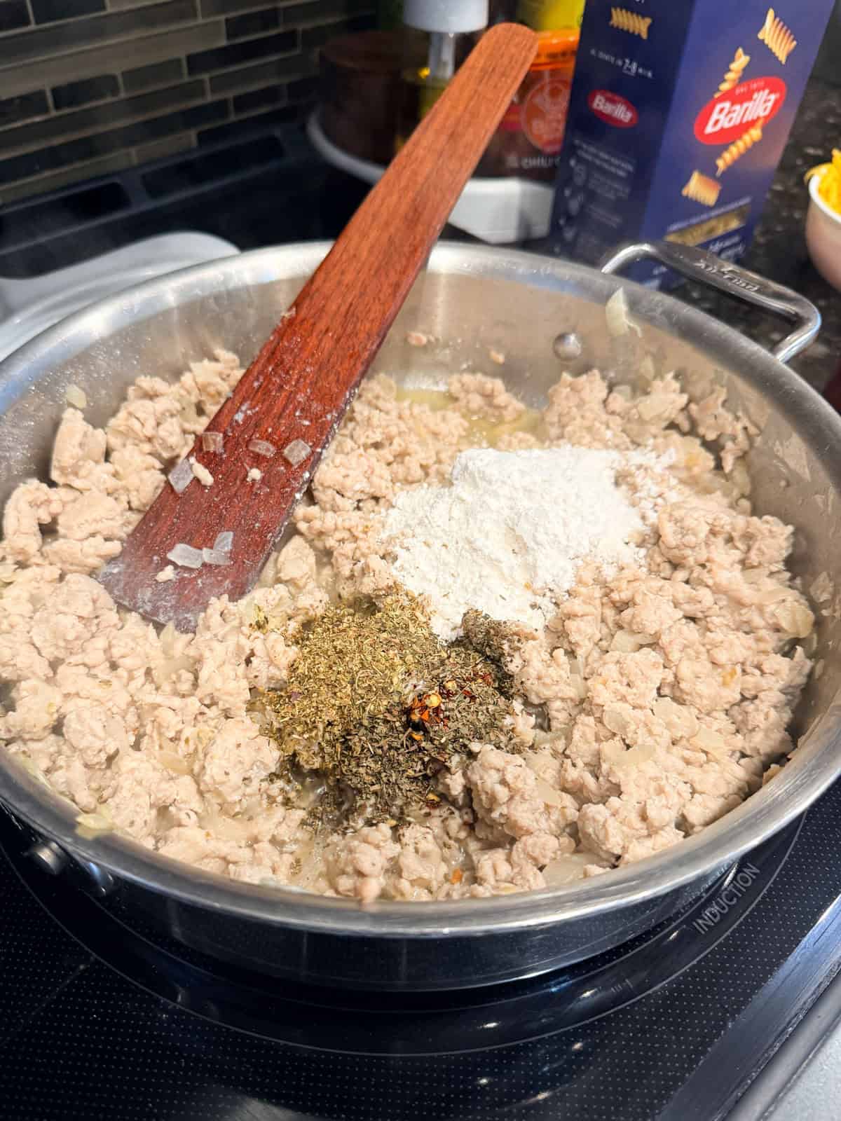 This easy beef pasta recipe is a one-pan dinner made in 30 minutes! Packed with juicy ground beef, cheese, and pasta in creamy tomato sauce. Seasonings added to ground beef and onions cooked in a skillet.