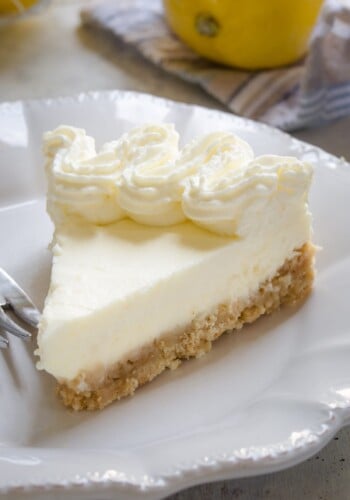 A slice of lemon cream pie on a plate.
