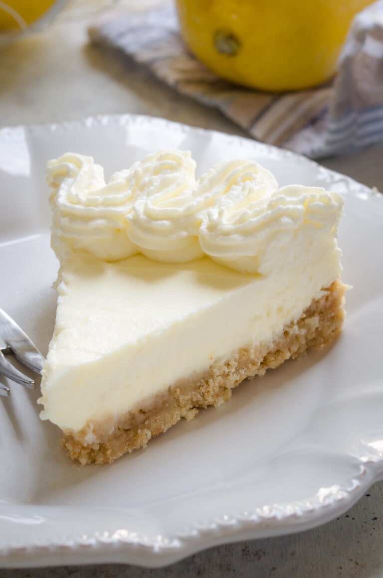 Slice of lemon cream pie on a plate.