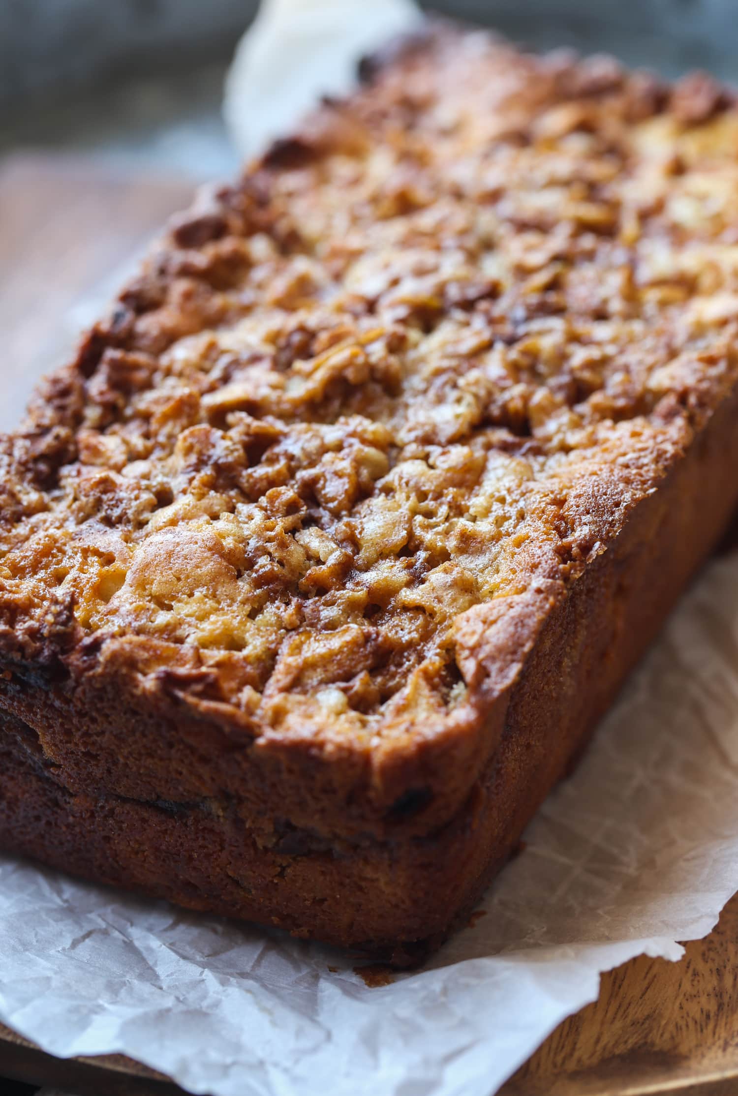 Apple Fritter Bread cooling on a piece of parchment paper