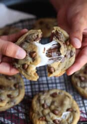 Smores Stuffed Chocolate Chip Cookies with gooey marshmallows inside