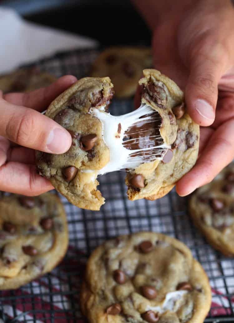 Smores Stuffed Chocolate Chip Cookies with gooey marshmallows inside