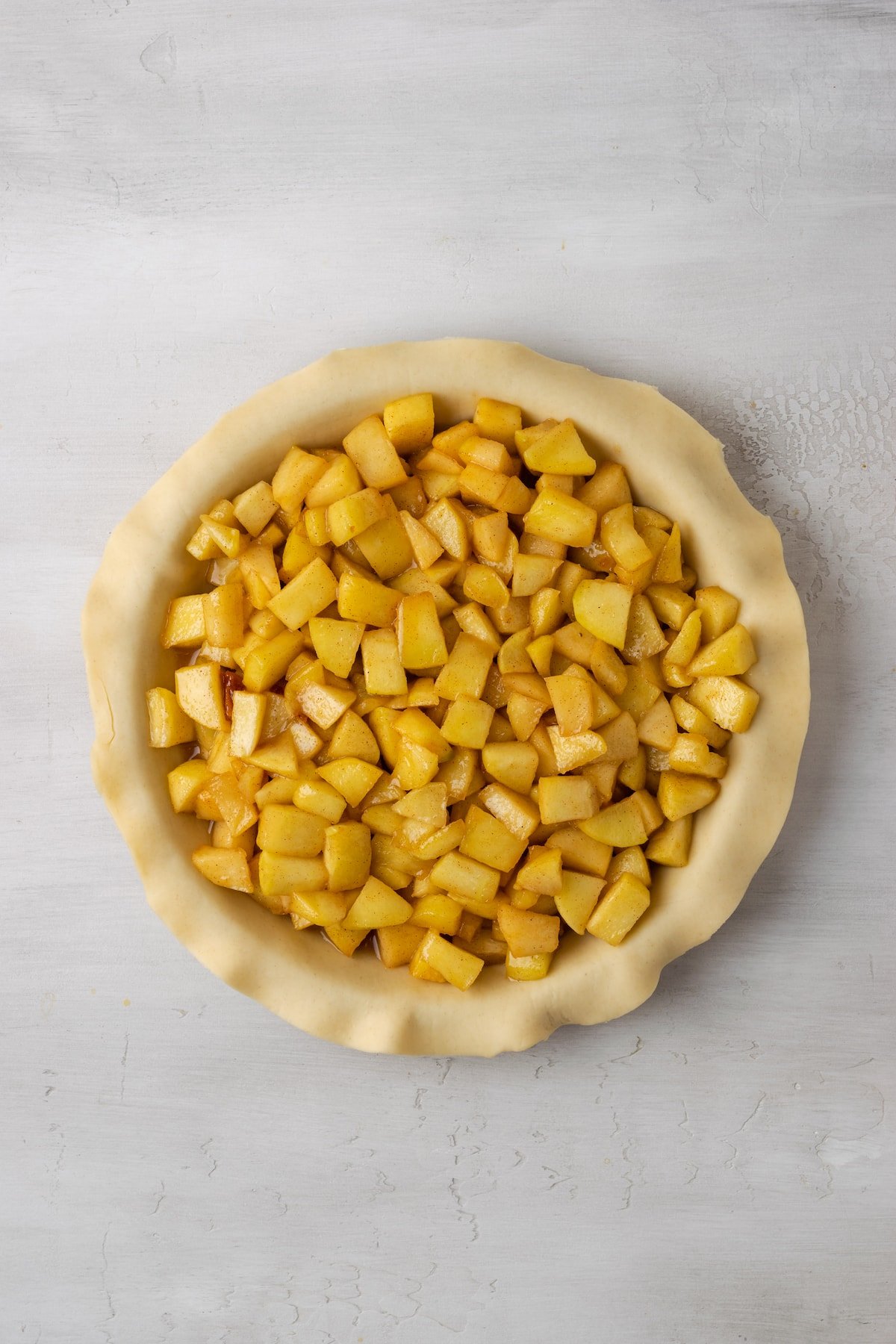 A flaky pie crust filled with apple pie filling.