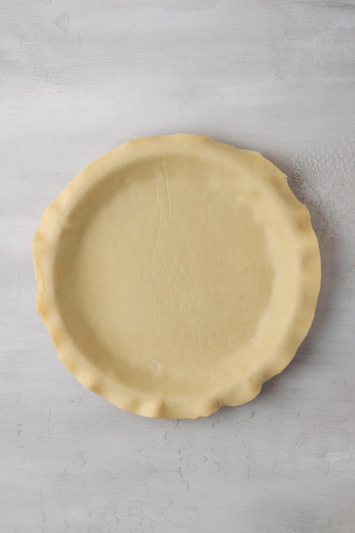 A flaky pie crust pressed into a 9-inch pie plate.