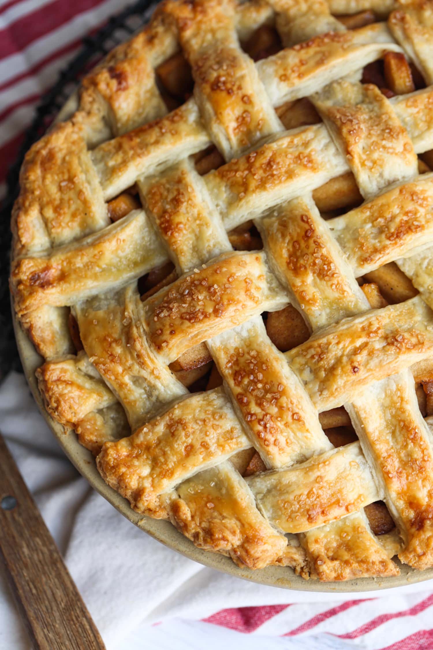 An apple pie with a lattice crust pie from above in a pie plate