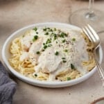 A plate of creamy angel chicken pasta.