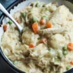 A bowl of slow cooker chicken and dumplings with shredded chicken