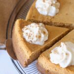 Sliced Pumpkin Cheesecake with whipped cream
