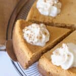 Sliced Pumpkin Cheesecake with whipped cream