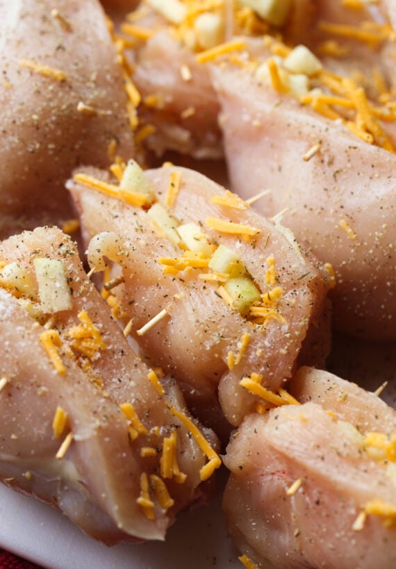 Stuffed raw chicken breasts before cooking