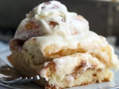 Bakery Style Cinnamon Rolls topped with buttercream frosting