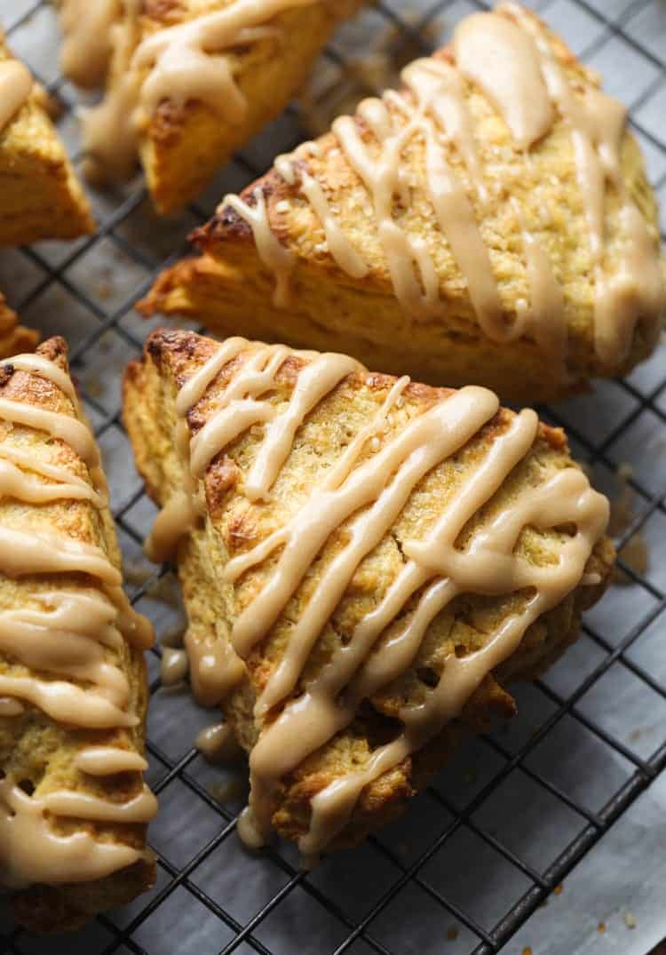 Pumpkin Scones with Brown Sugar Icing on a wire cooling rack.