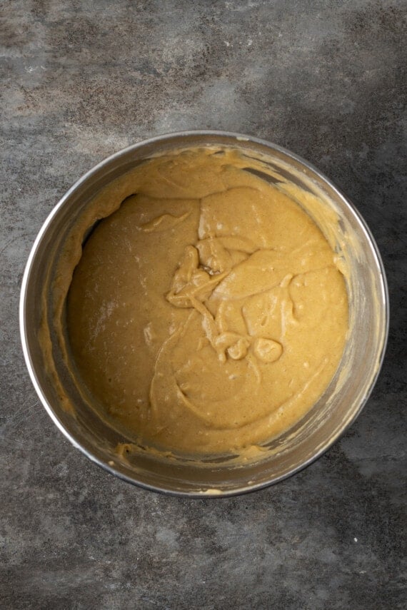 Snickerdoodle cupcake batter in a metal bowl.