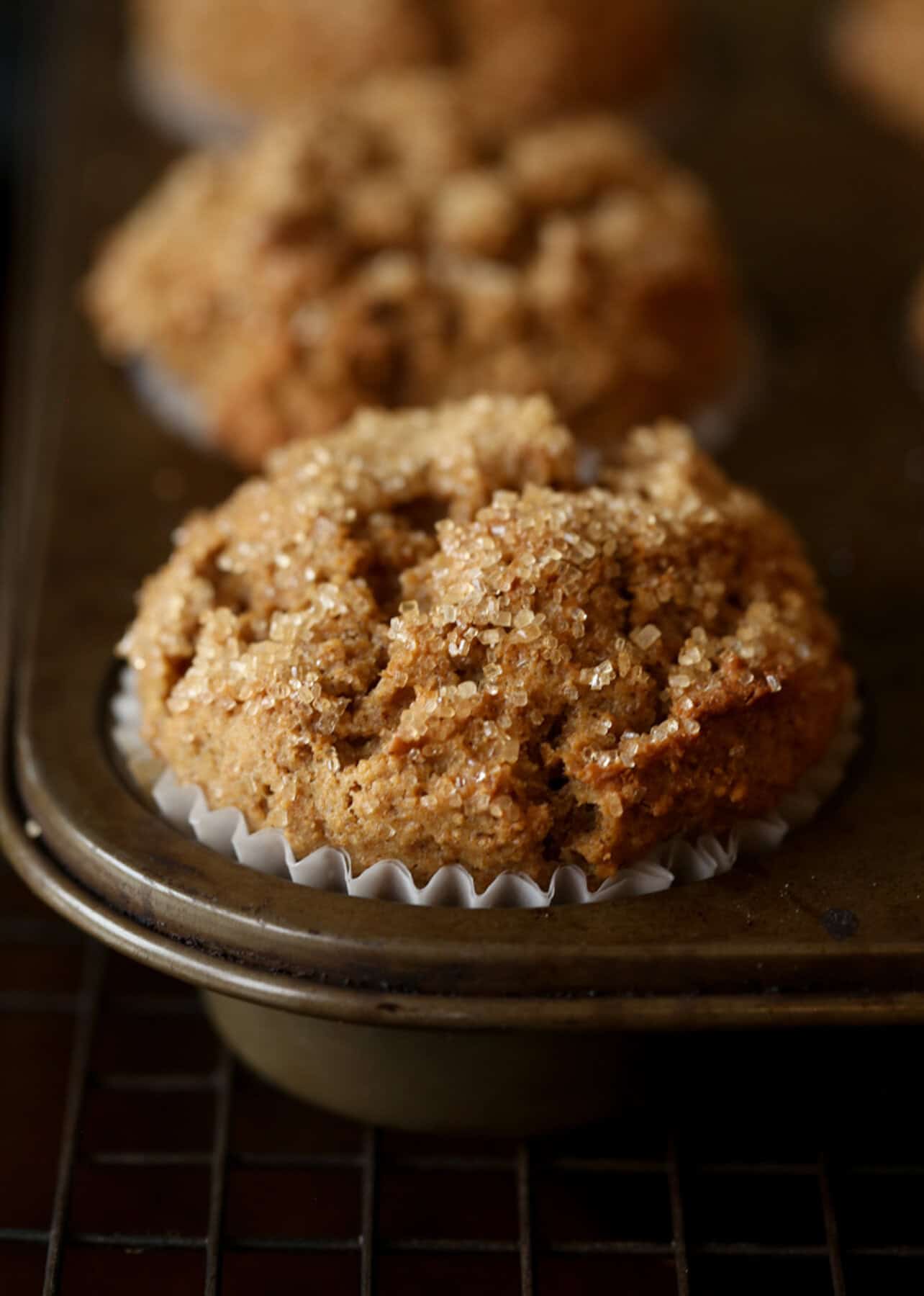 Close up of baked bran muffins in a muffin pan.