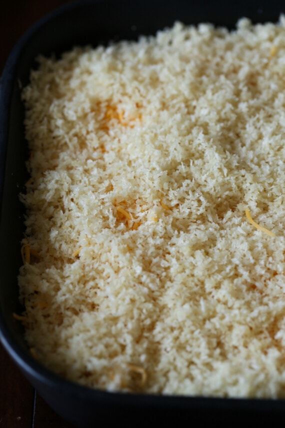 Overhead view of panko breadcrumbs on top of an unbaked casserole.