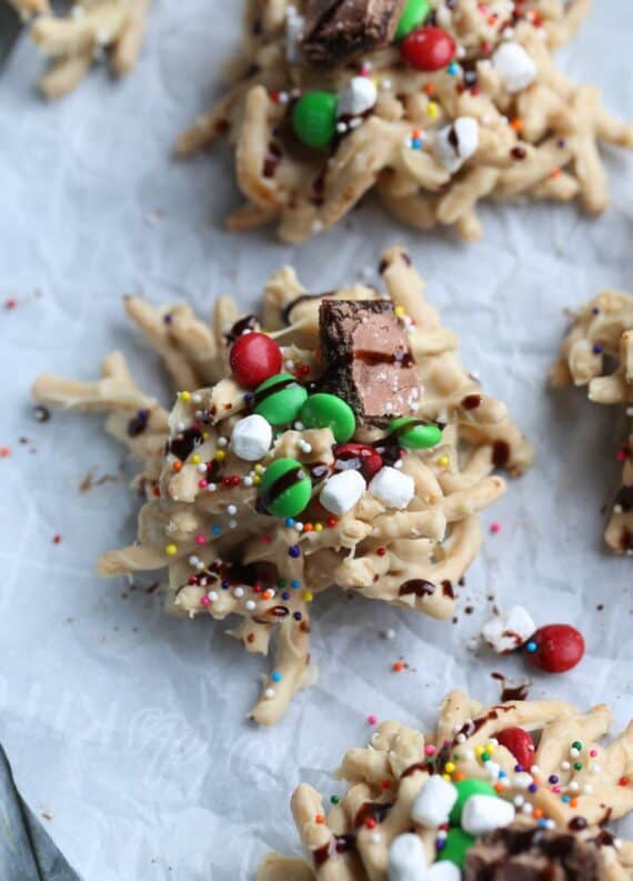 Elf Cookies with M&Ms, marshmallows, spriinkles, and chocolate drizzle