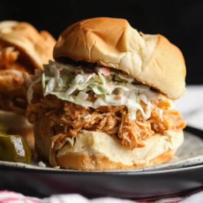 BBQ Pulled Chicken on a bun topped with cole slaw