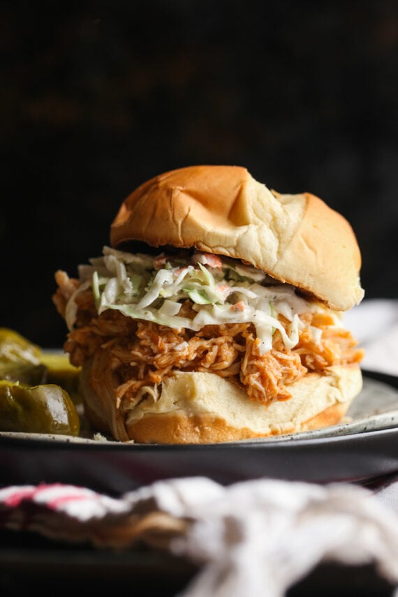 Crockpot Shredded Chicken on a plate topped with cole slaw