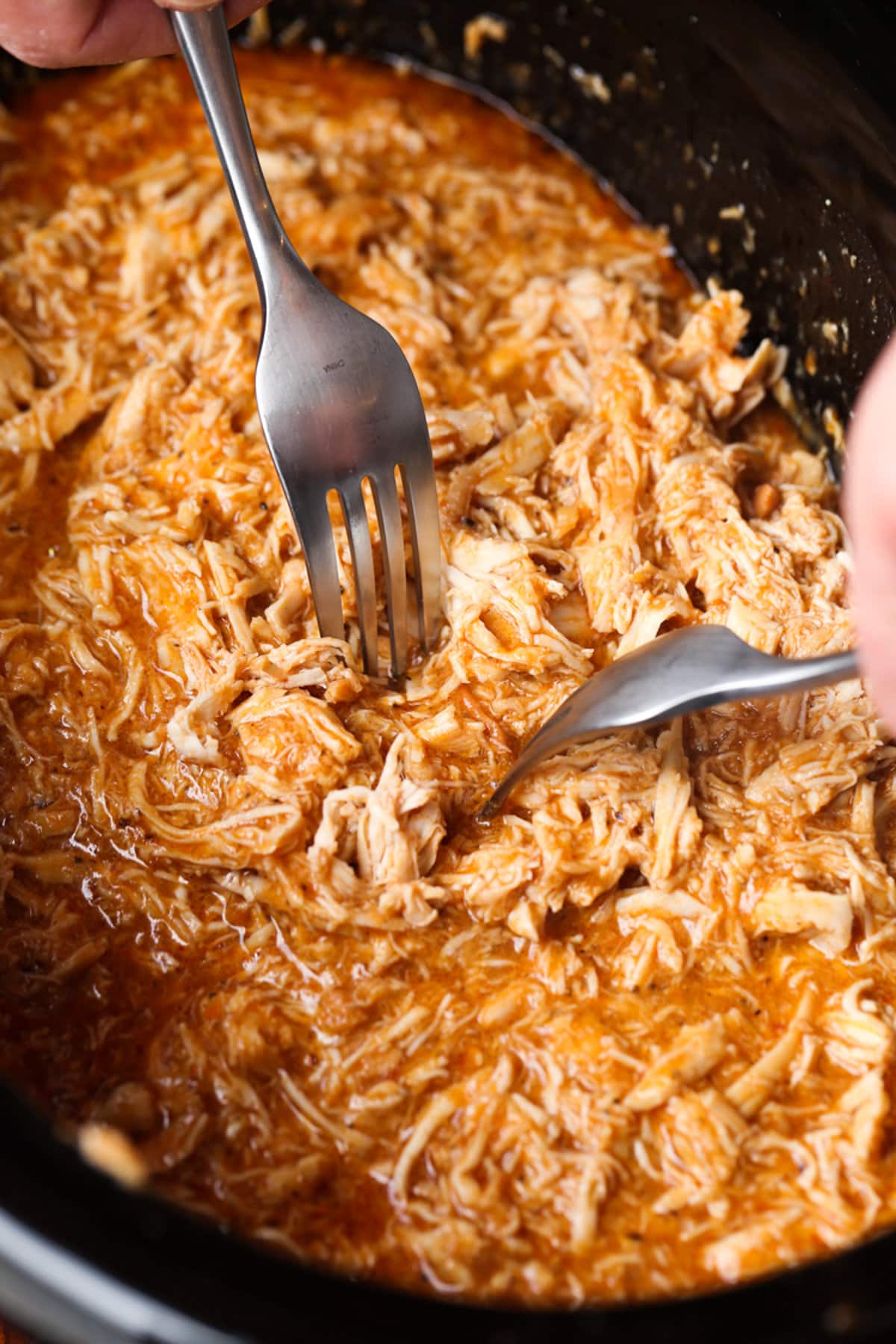 Shredded barbecue chicken in a clay pot