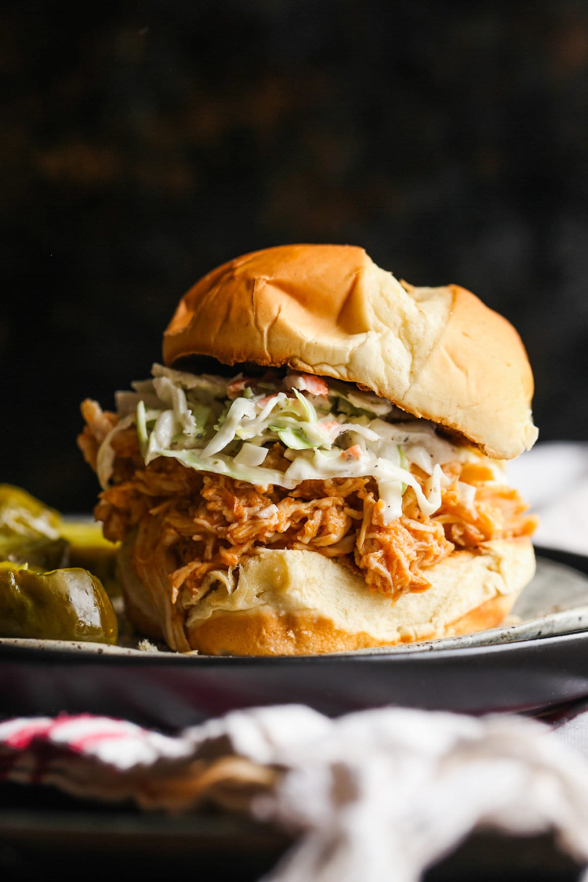 Crockpot BBQ Chicken on a bun with cole slaw