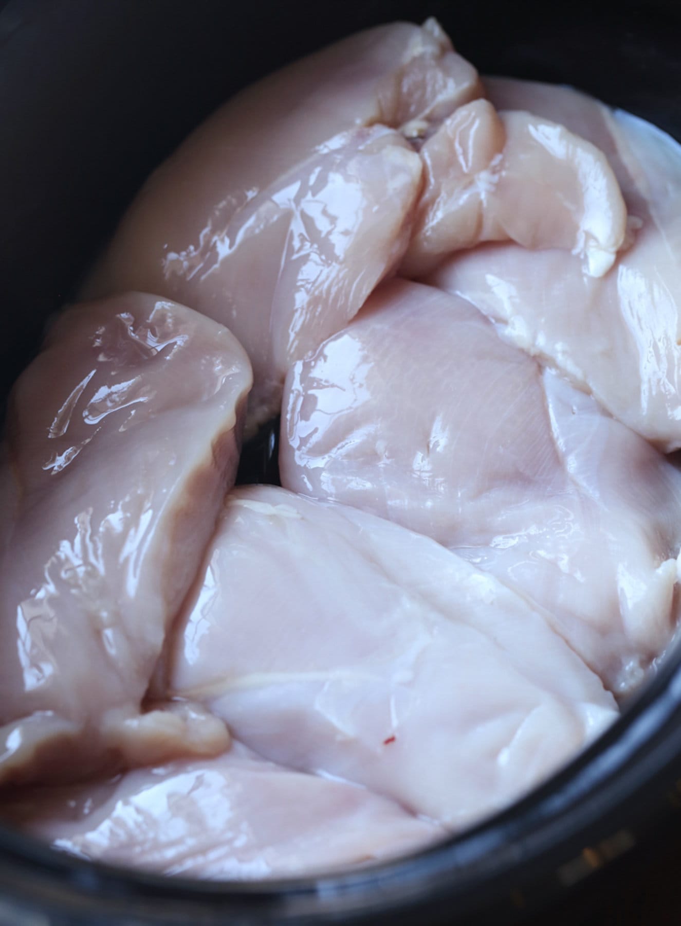 raw chicken breasts in a crock pot