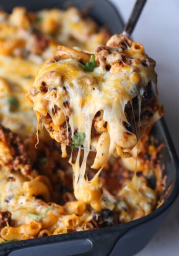 Serving Chili Mac Casserole with cheese pull