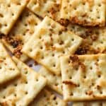 Seasoned Saltines on a baking sheet