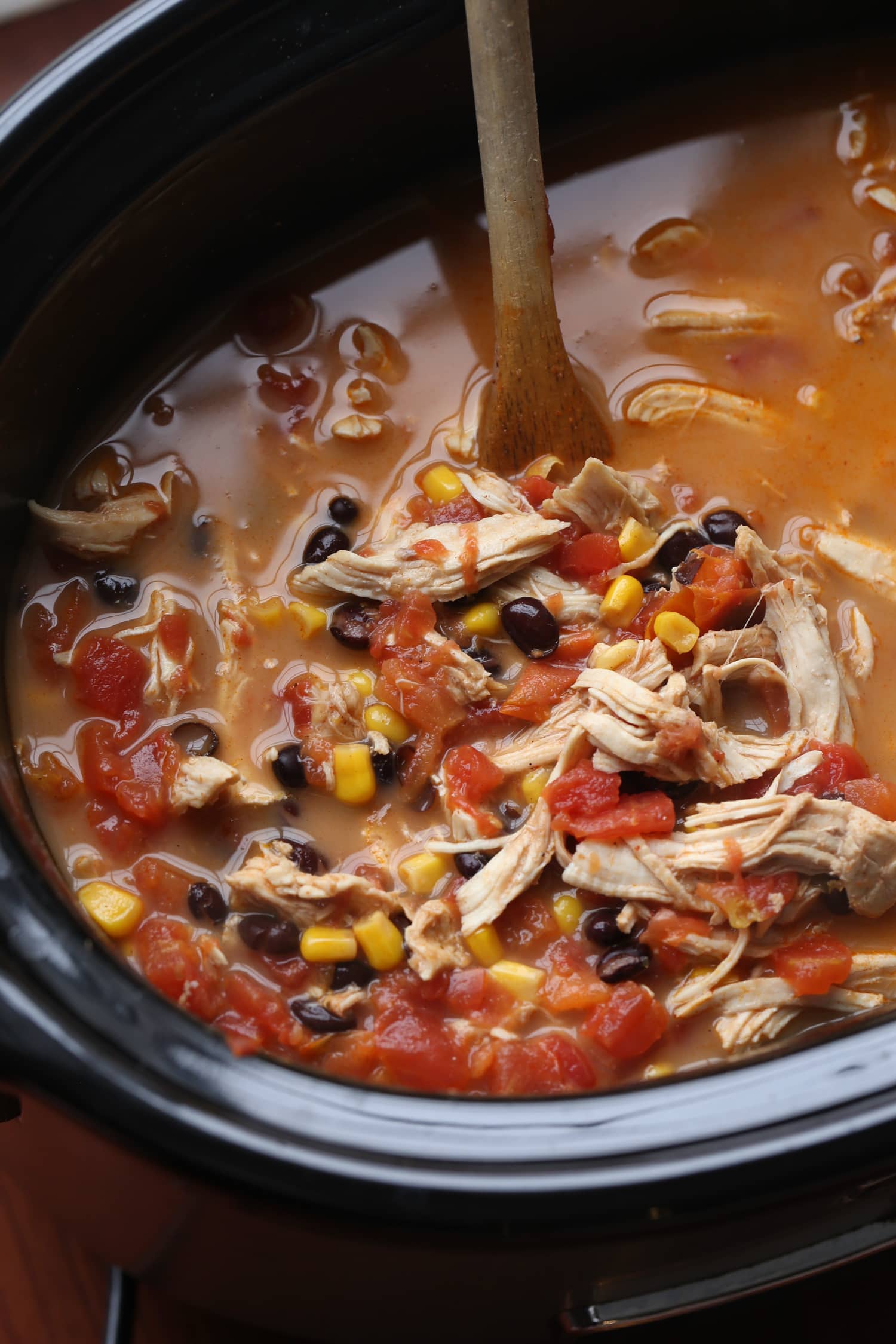tortilla soup with chicken and black beans in a crock pot slow cooker