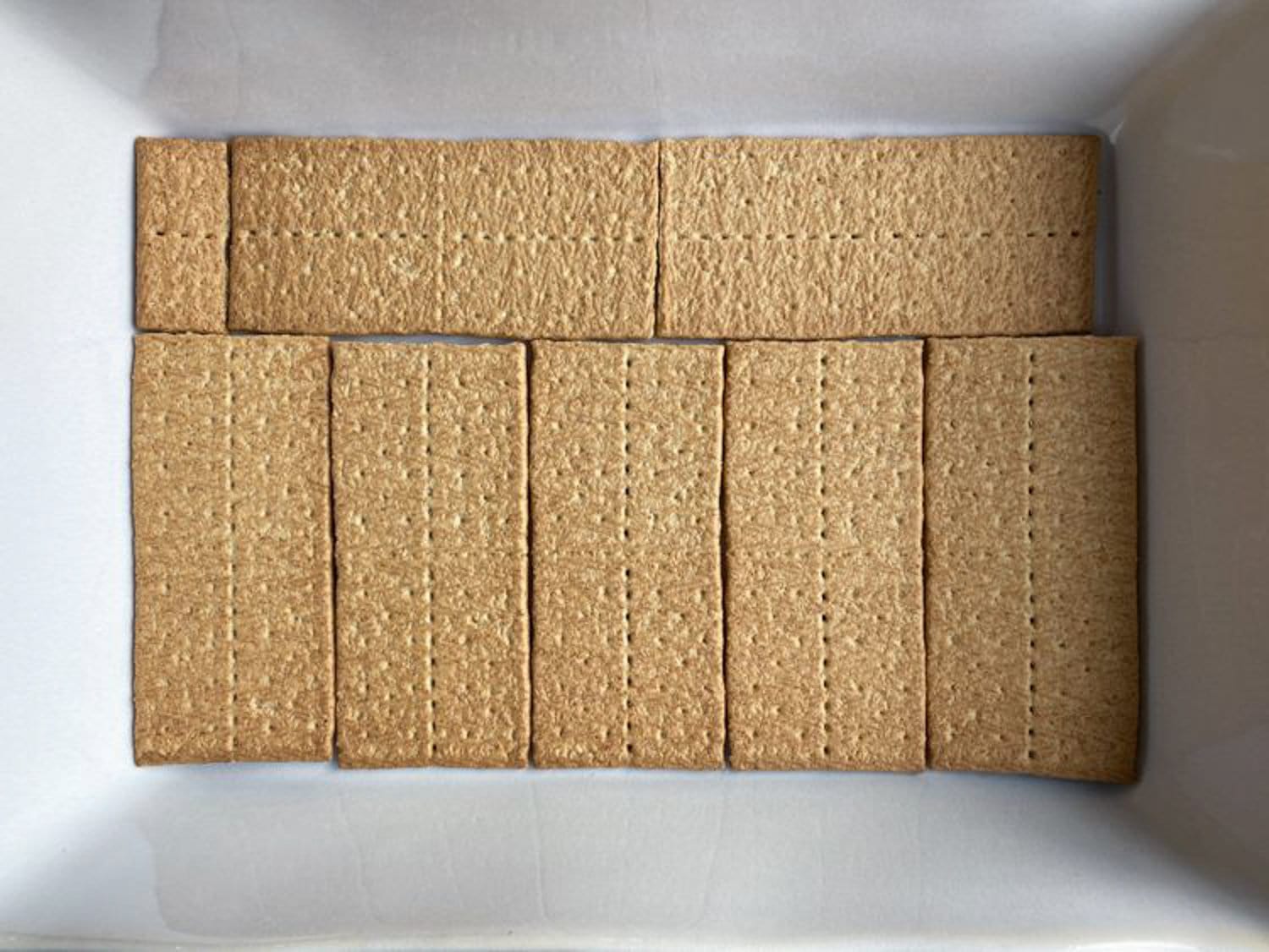 Graham crackers laid out on in a pan