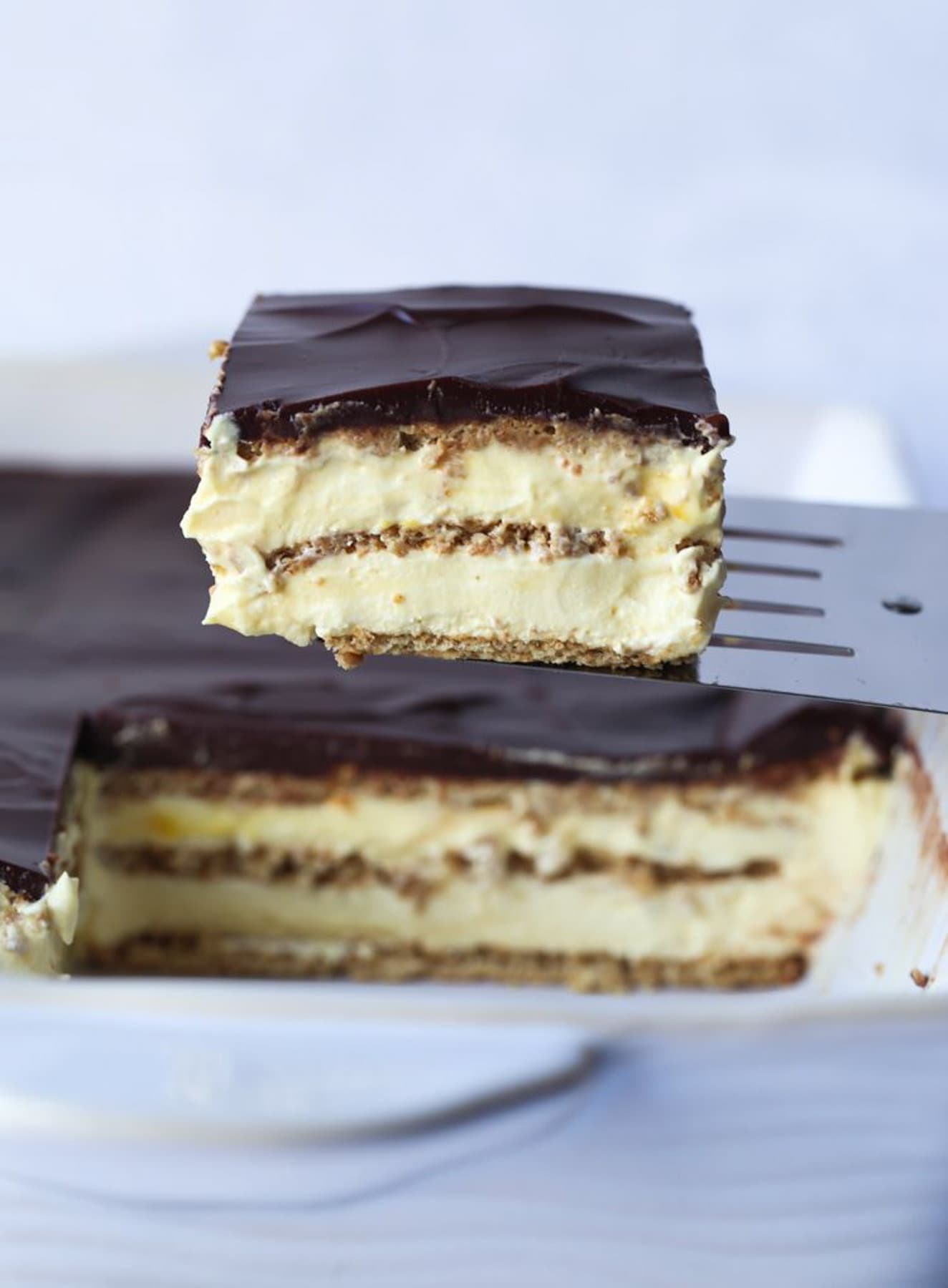 No Bake Eclair Cake Slice on a Spatula