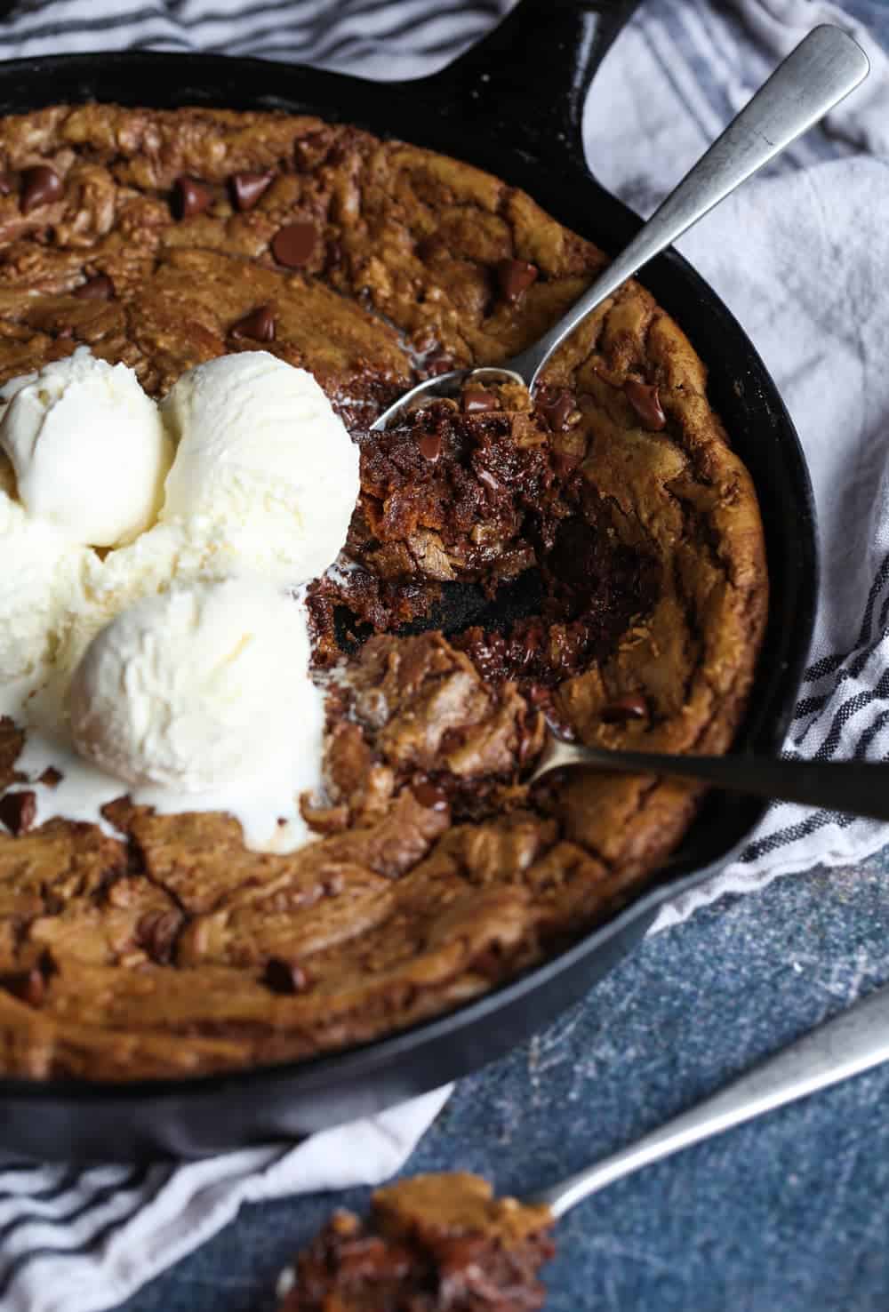 Pizookie Cookie in a skillet with ice cream