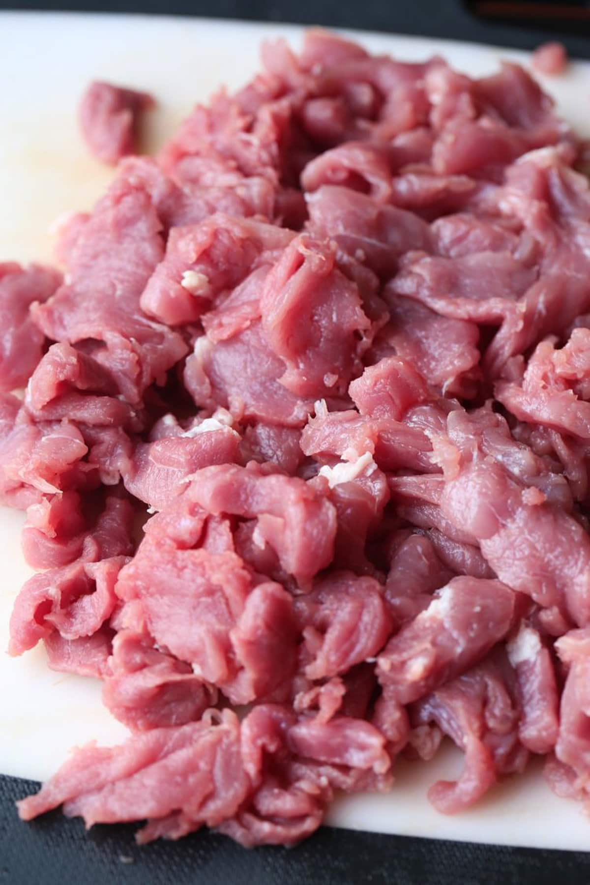 Raw pork diced up.