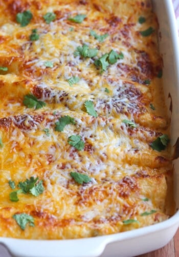 casserole dish with cheese covered enchiladas