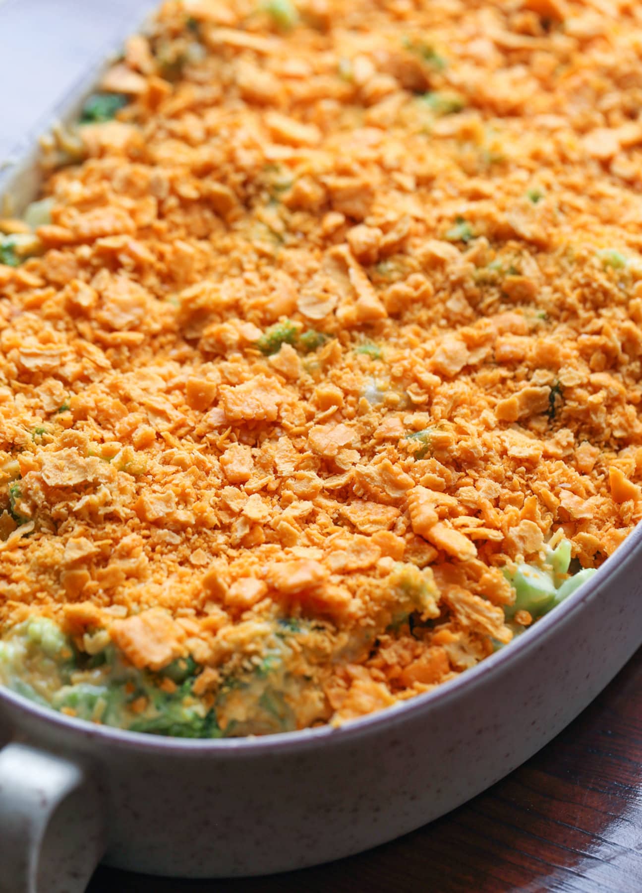 Broccoli and cheese casserole with crushed cheese crackers on top