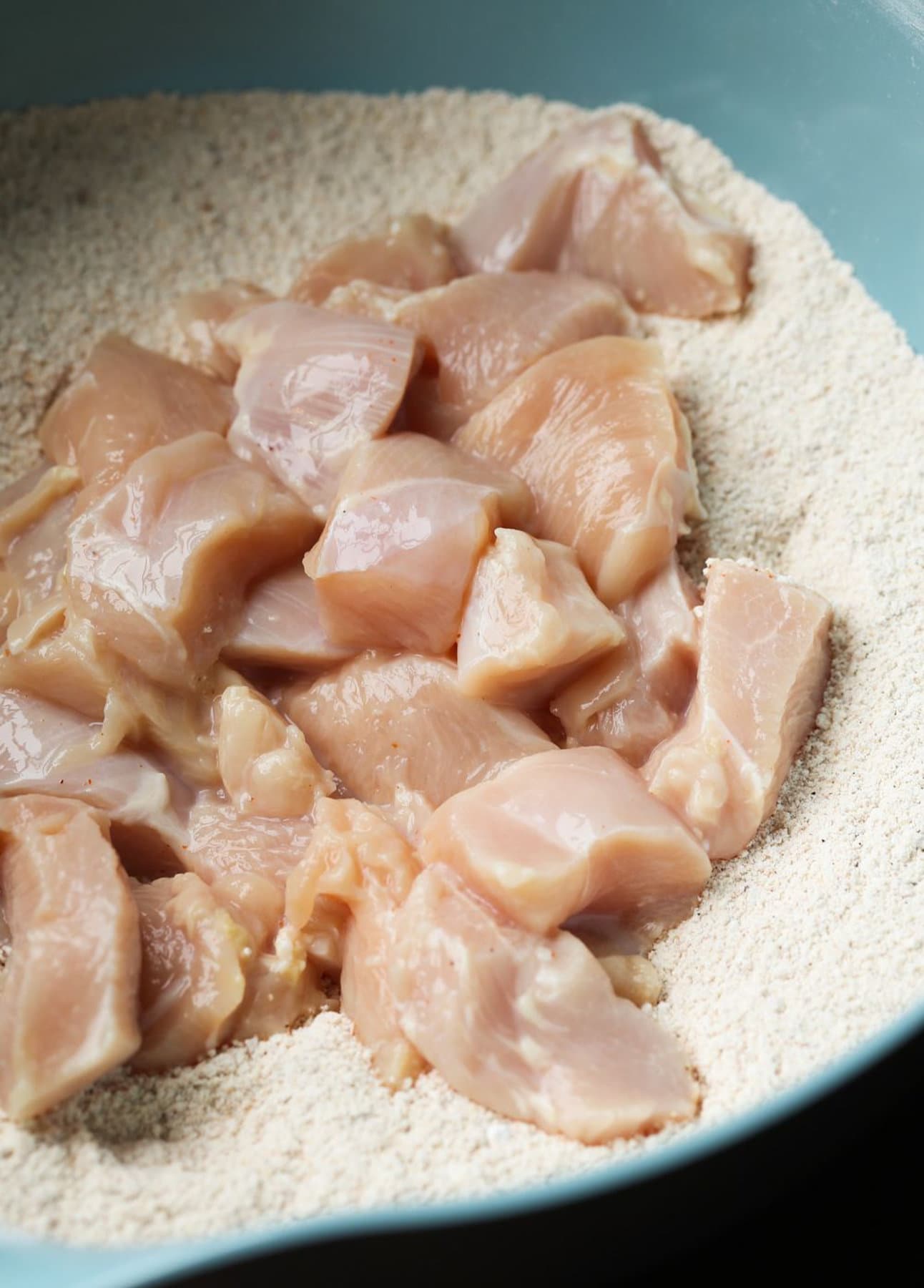 Diced Chicken in flour mixture.