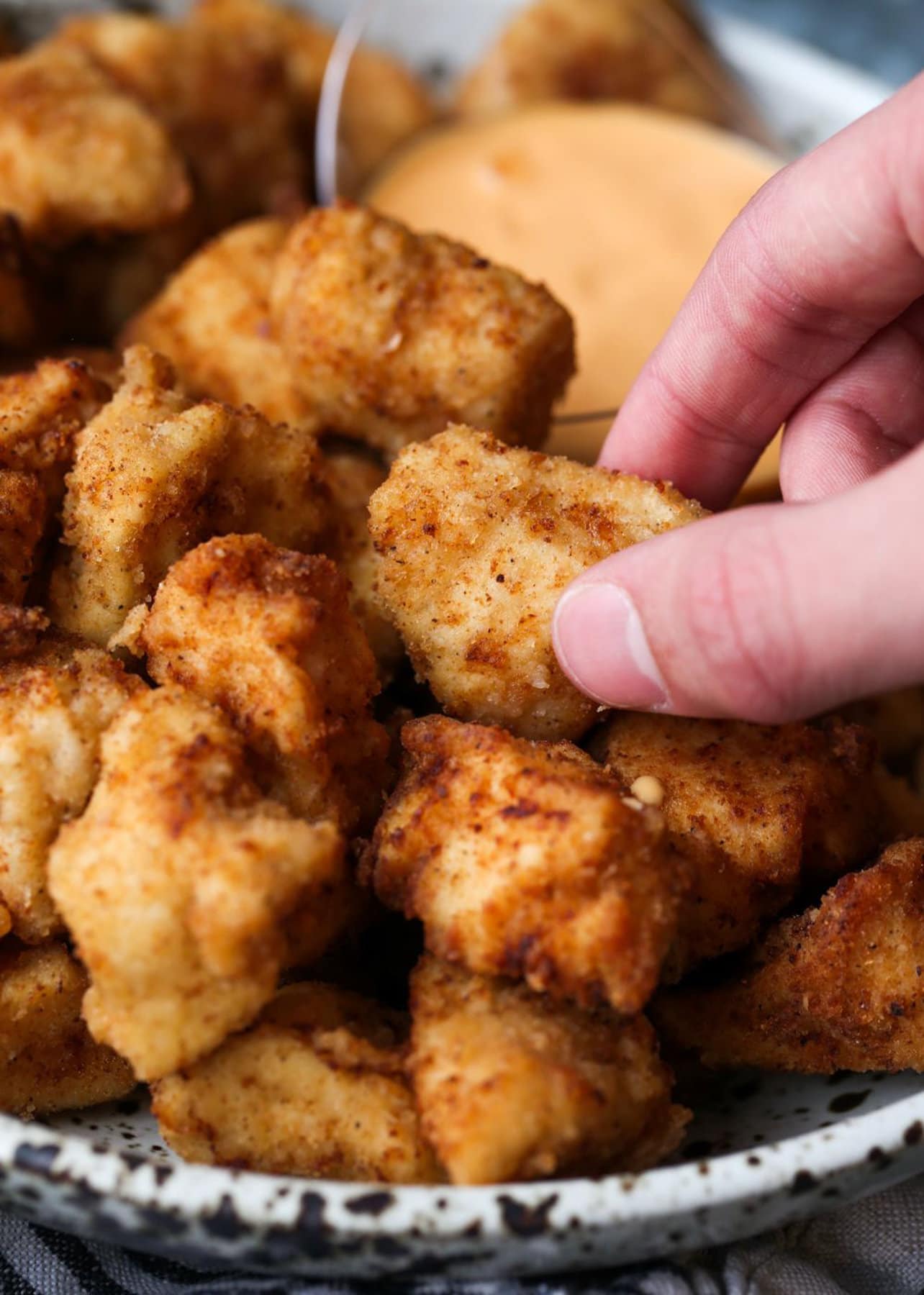 Eating Chicken Nuggets on a plate