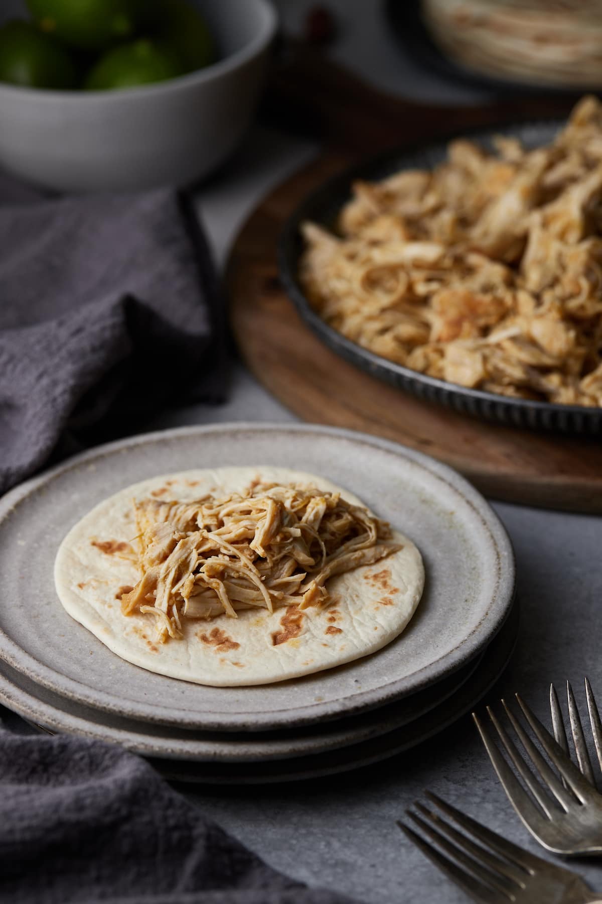 Salsa Verde Chicken served on a flour tortilla.