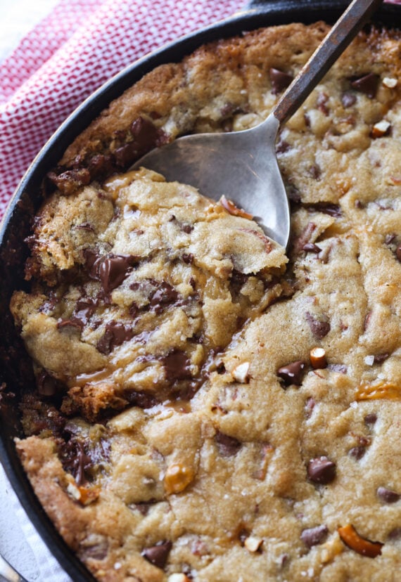 Spoon scooping out pizookie in a skillet