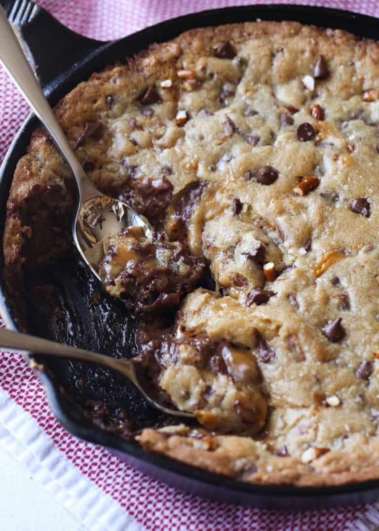 Eating salted caramel pizookie out of the skillet with spoons