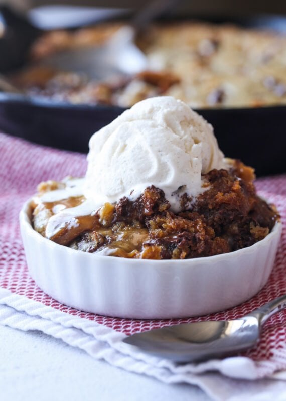 Salted caramel filled cookie in a ramekin with ice cream