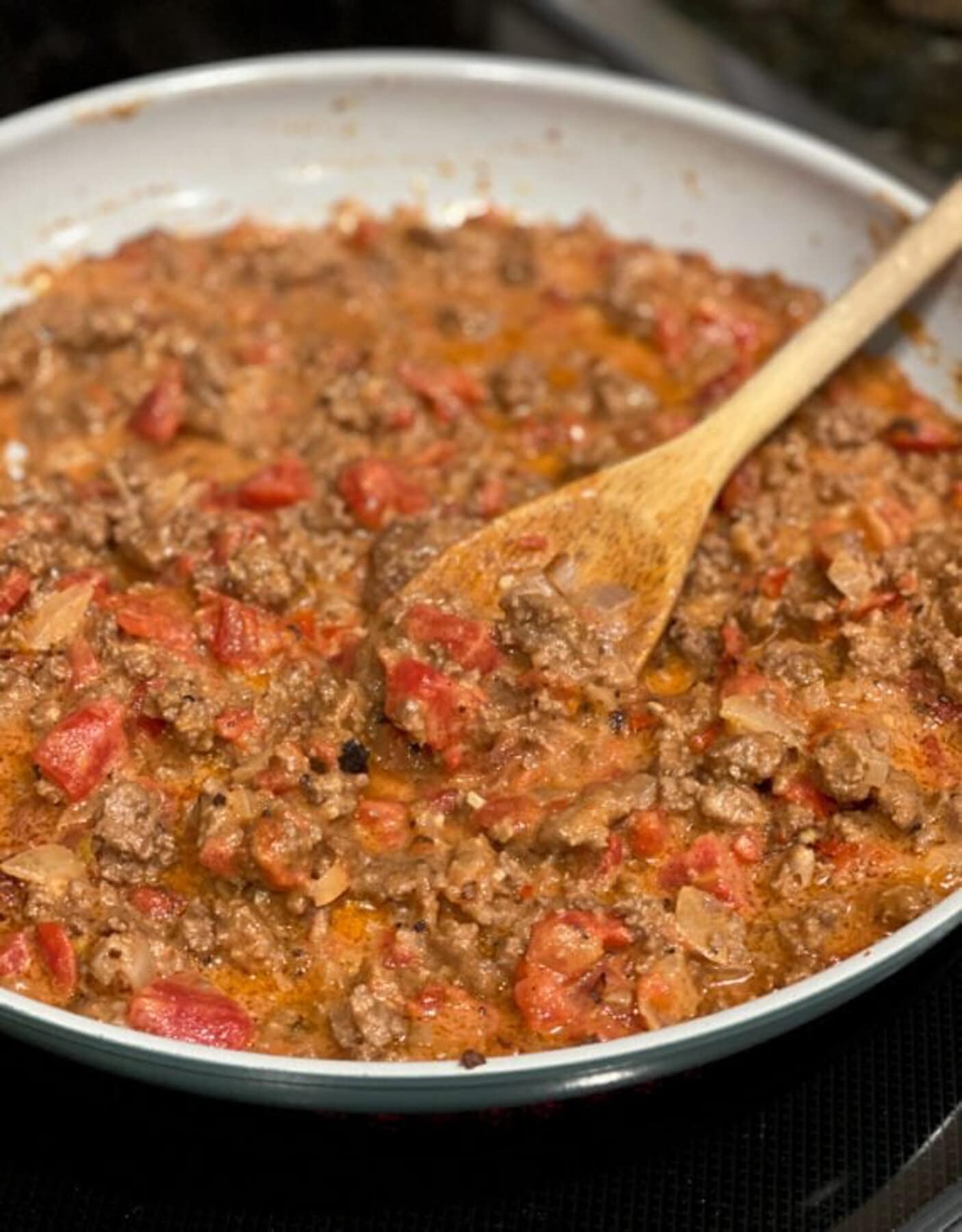 Ground Beef with tomatoes in a skillet