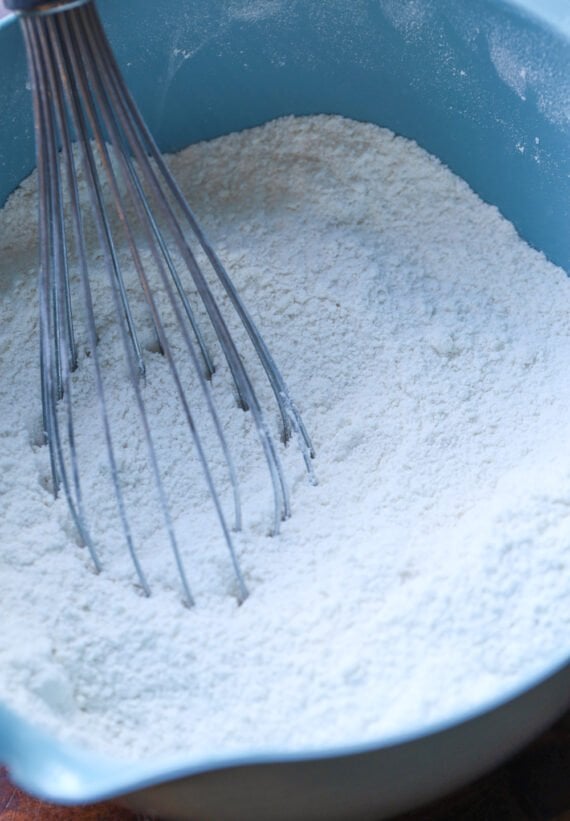 Whisking together the dry ingredients in a bowl for homemade cake mix