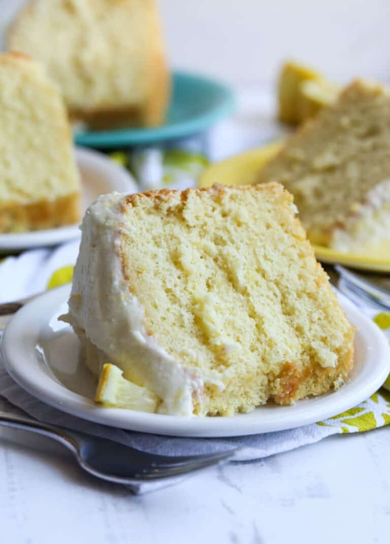 A slice of lemon chiffon cake on a plate.