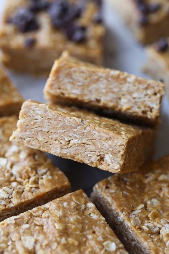 No Bake Oat Squares cut and stacked on parchment paper