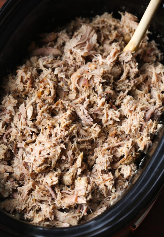 Shredded pulled Kalua pork in a crock pot.